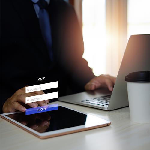 A Businessman Using a Tablet to Log in to The Best Bank Accounts Website