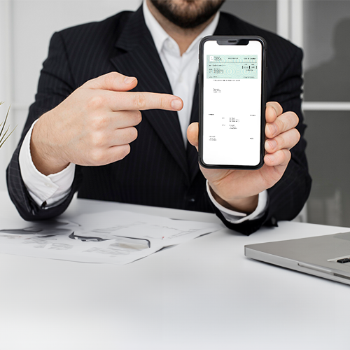 A Man in a Suit Is Holding Up a Cell Phone, Showcasing the Convenience of Free Instant Mobile Check Deposit.