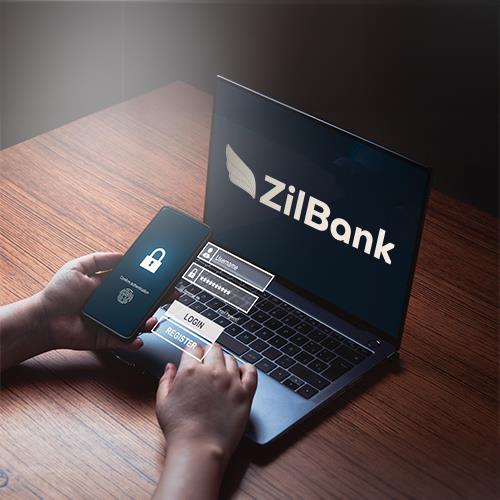 A Person Using a Laptop with the ZilBank Logo on It, Exploring Features Such as Nearside Business Checking.