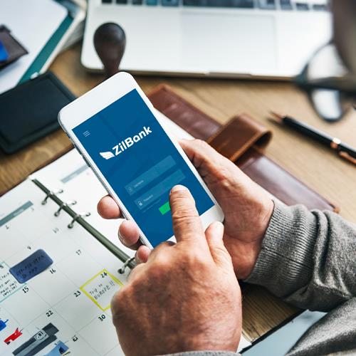 A Man Is Using a Smart Phone to Log into His Bank Account for the Best Free Online Banking Experience