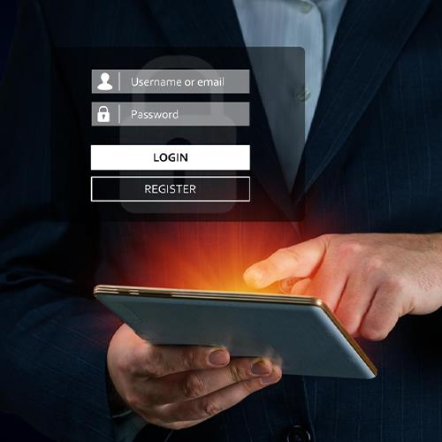 A Man in a Suit Is Using a Tablet with a Business Bank Account Login Screen Displayed.