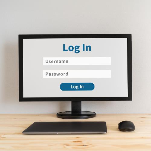 A Computer Showcasing a Login Screen for a Service Offering a Free Bank Account To Open, Accompanied by a Keyboard and Mouse.