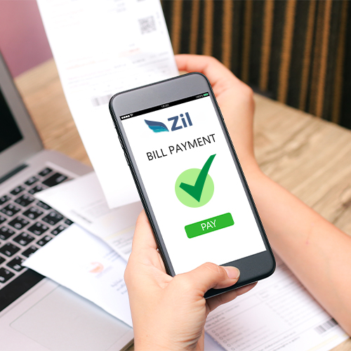 Get Paid Online with a Person Using a Smartphone Displaying a Bill Payment App Screen, Featuring a Checkmark and a Green Pay Button