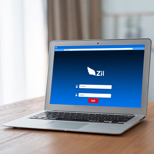 A Laptop on a Wooden Desk Displaying Revolut Online Banking Alternative Login Screen with Username and Password Fields