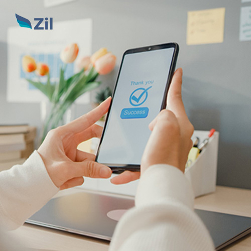 A Woman Using a Smartphone to Make Online Payment Processing Service, with a Check Mark on the Screen