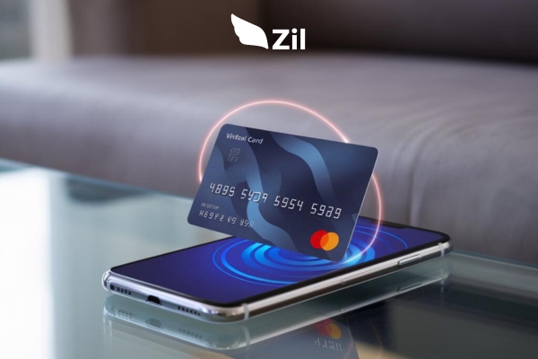 Free Virtual Debit Card Pictured Hovering Over a Smartphone on a Blue Background Depicting an Online Payment Concept