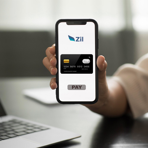 A Hand Holding a Smartphone Showing Zil Checking Account. Empower Businesses with the Enhanced Financial Control of Virtual Card Instant